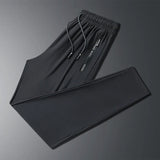 New Summer Korean Ice Silk Elastic Trousers Cool Thin Casual Men'S Loose Long Large Size Small Foot Sports Pants 8XL We Men's Store