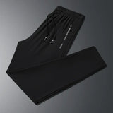 New Summer Korean Ice Silk Elastic Trousers Cool Thin Casual Men'S Loose Long Large Size Small Foot Sports Pants 8XL We Men's Store