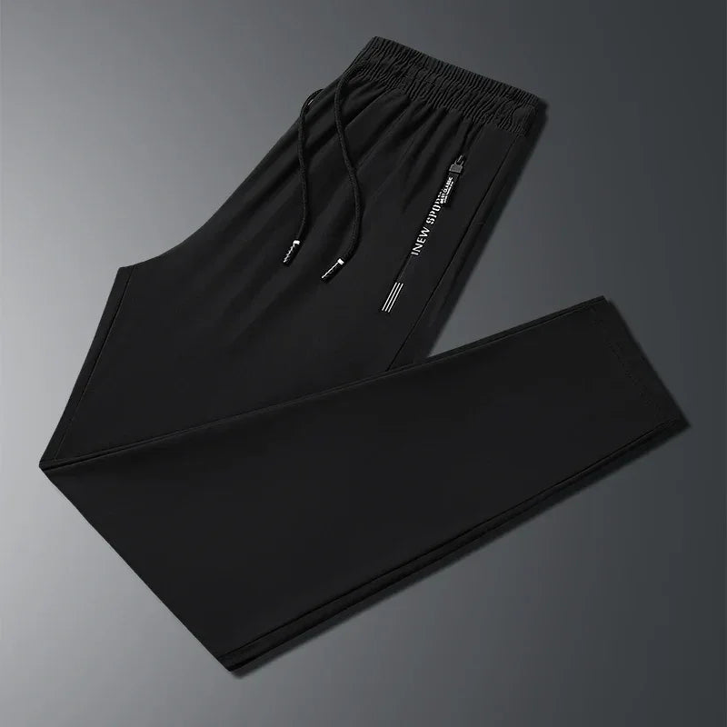 New Summer Korean Ice Silk Elastic Trousers Cool Thin Casual Men'S Loose Long Large Size Small Foot Sports Pants 8XL We Men's Store